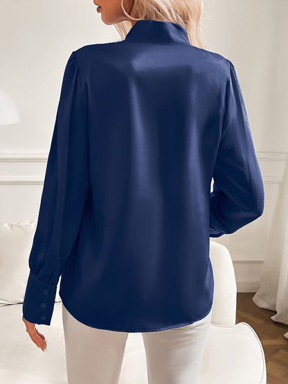 Damesblouse met strikhals en pofmouwen