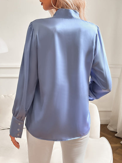 Damesblouse met strikhals en pofmouwen