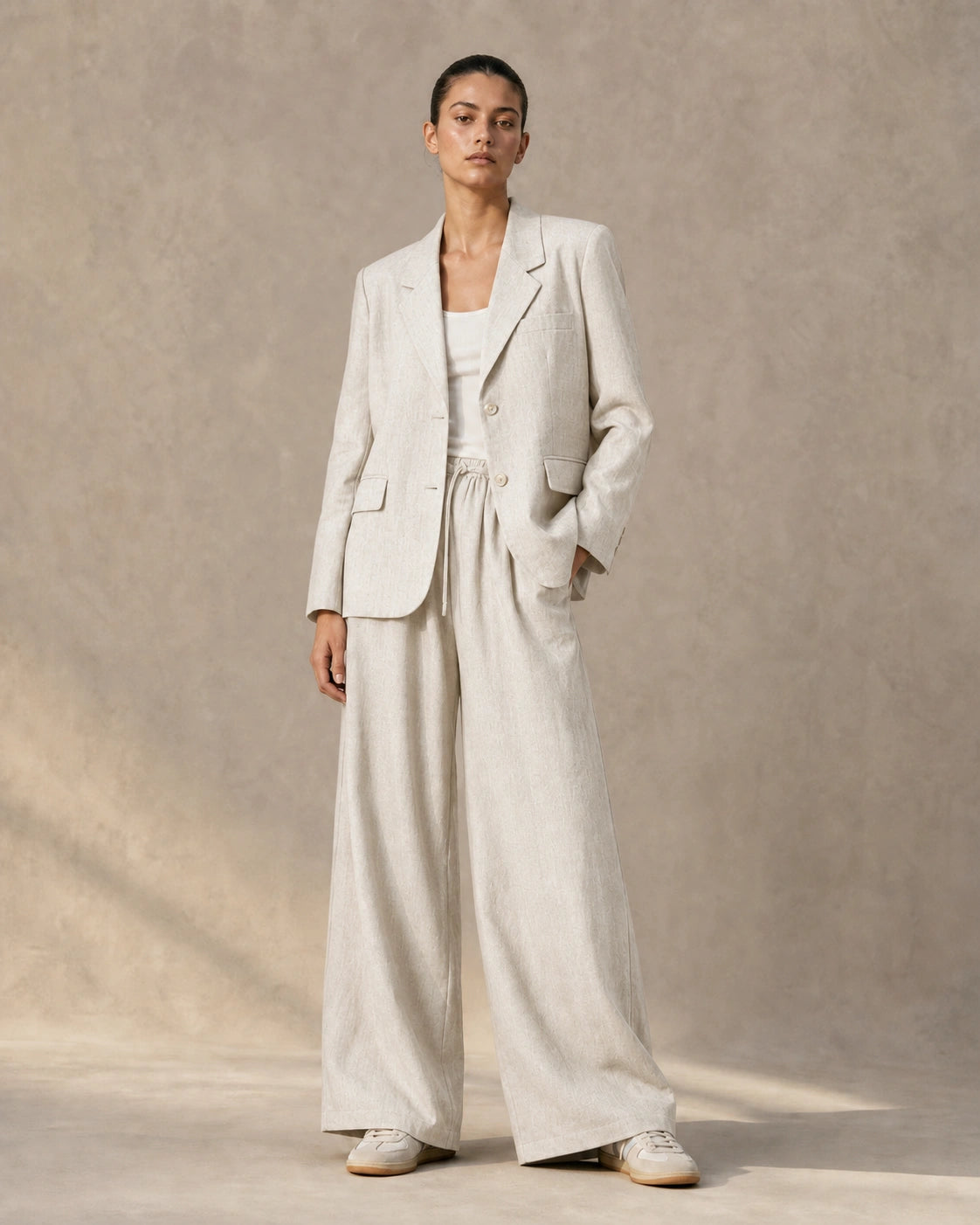 Apricot tencel-linen blazer and tailored trousers co-ord set, detail shot.