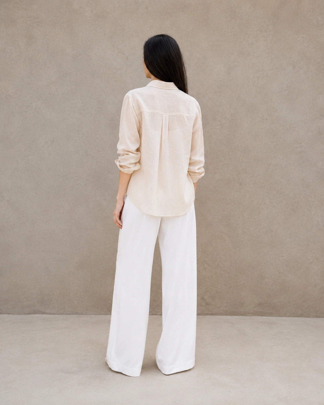 Back view of a beige lyocell-linen cardigan-style shirt with long sleeves.