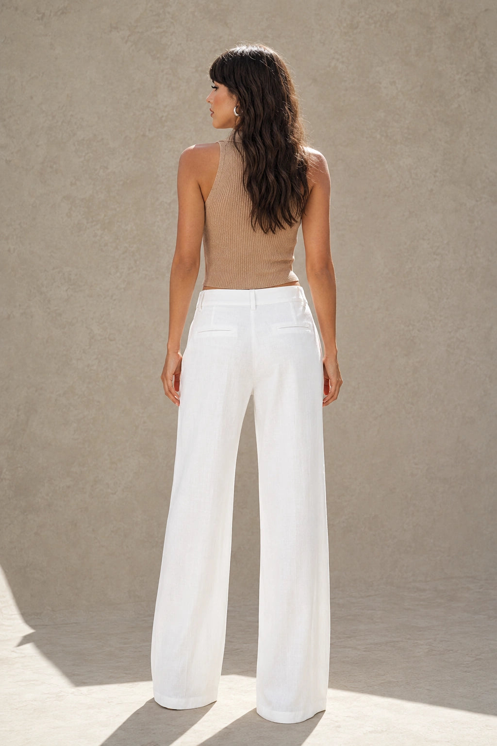 White wide-leg linen-cotton trousers with a high waist, styled shot.