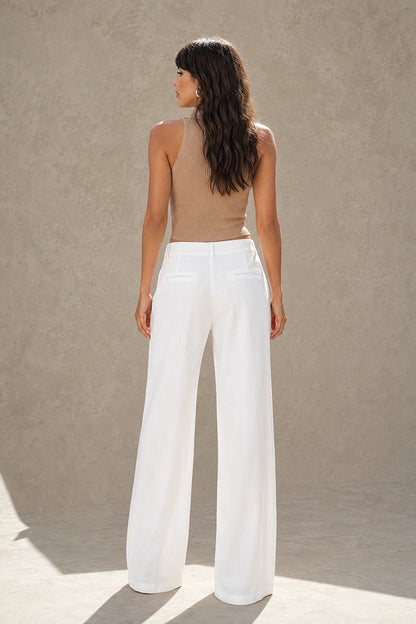 White wide-leg linen-cotton trousers with a high waist, styled shot.