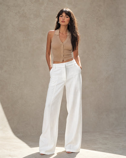 White wide-leg linen-cotton trousers with a high waist, studio product shot.