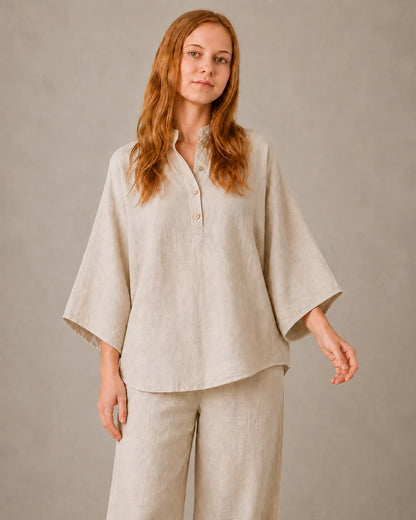 Close-up of the khaki cotton-linen co-ord set's collared neckline and button fastening.