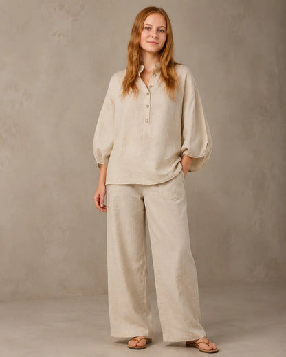 A closer front view of a model wearing the khaki cotton-linen co-ord set, showing the shirt's button placket and the trousers' relaxed fit.