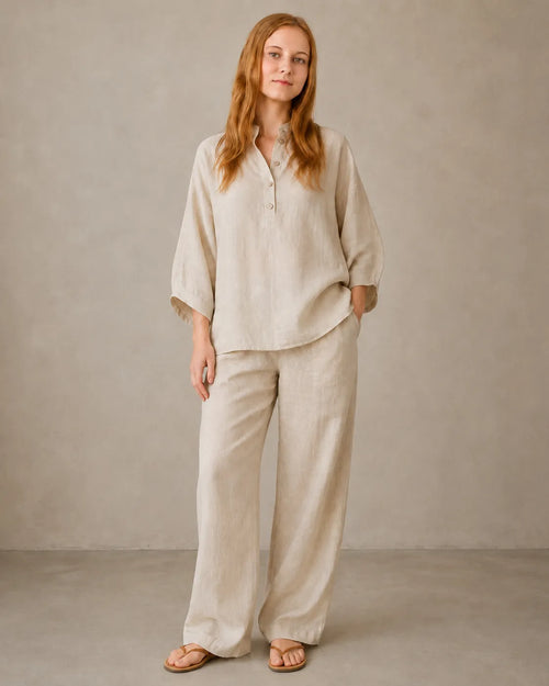 A model wears the cotton-linen co-ord set in khaki, styled with a long-sleeve collared shirt and matching trousers, standing in a relaxed front pose.