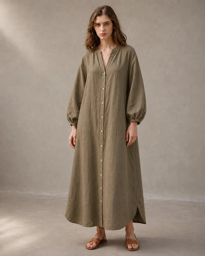 Close-up of a woman wearing a khaki cotton-linen dress, showing the long balloon sleeves with elasticated cuffs.