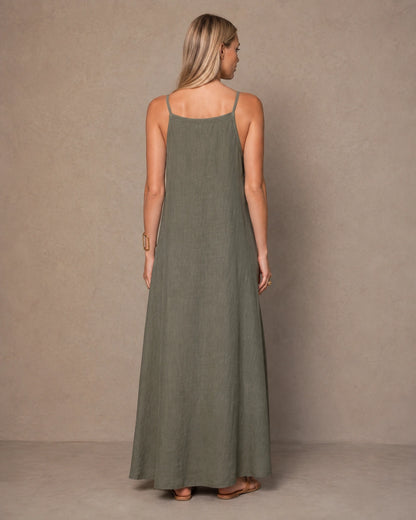 Back view of an army green cotton-linen halter dress with thin adjustable straps, shown on a model.