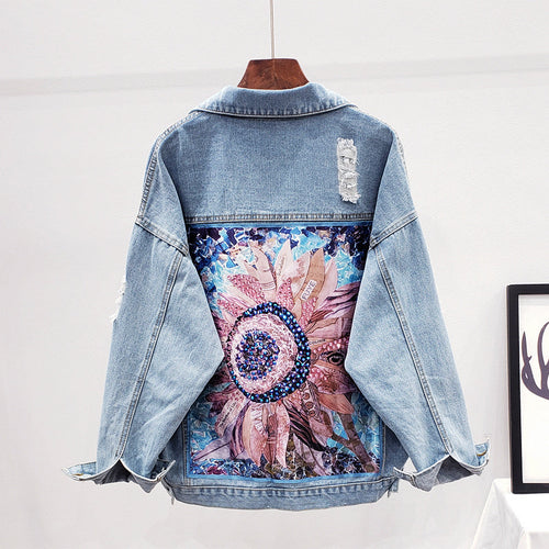 Dames spijkerjack met knoopsluiting en rugprint