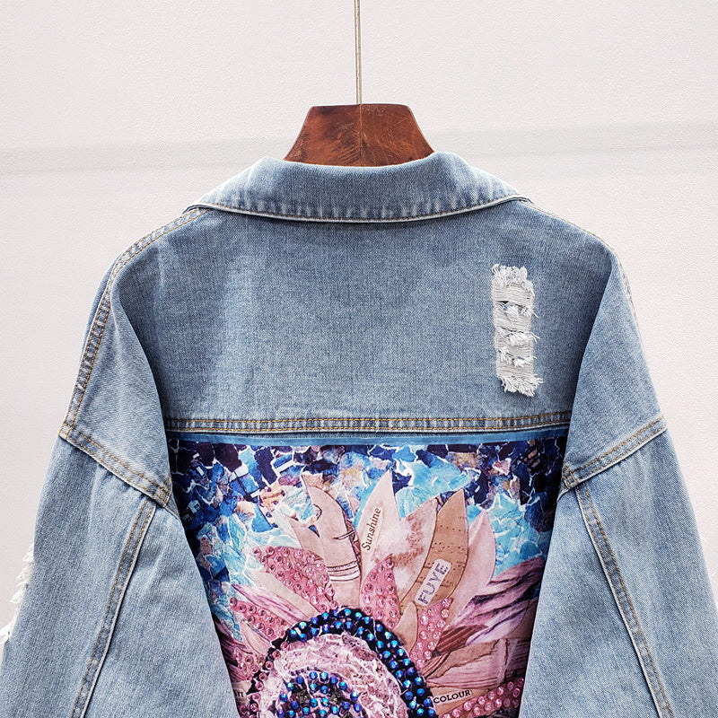 Dames spijkerjack met knoopsluiting en rugprint