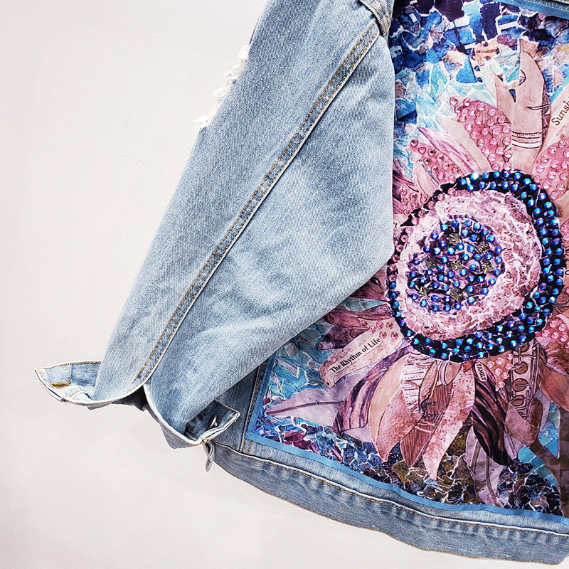 Dames spijkerjack met knoopsluiting en rugprint